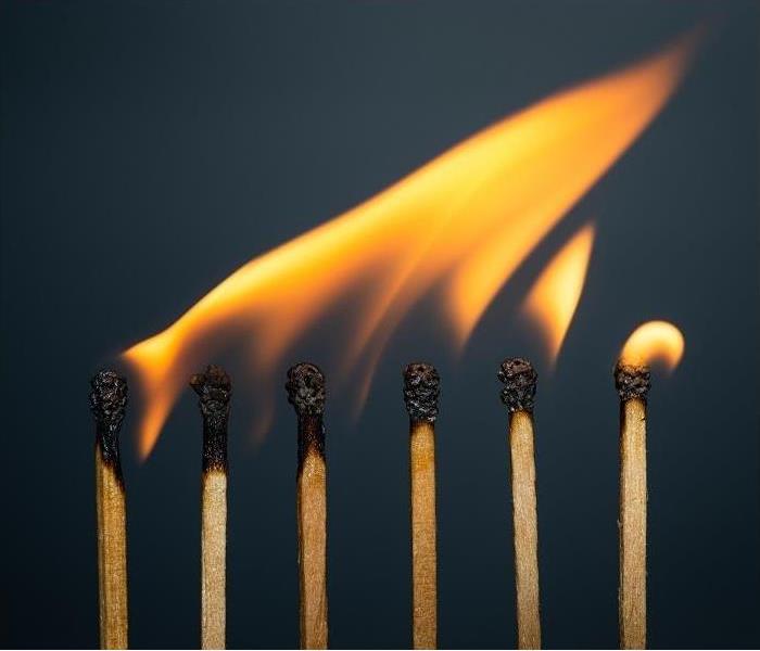 line of matches with tips ignited into flames