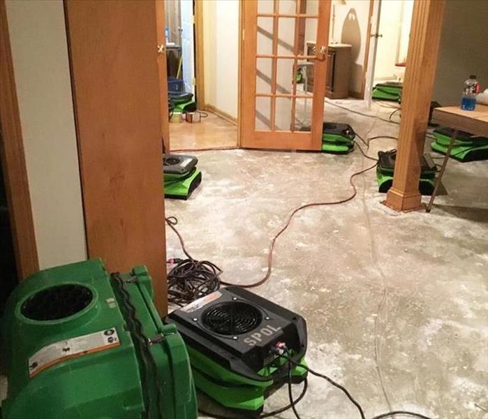 flood damage restoration - air movers in Kansas City home