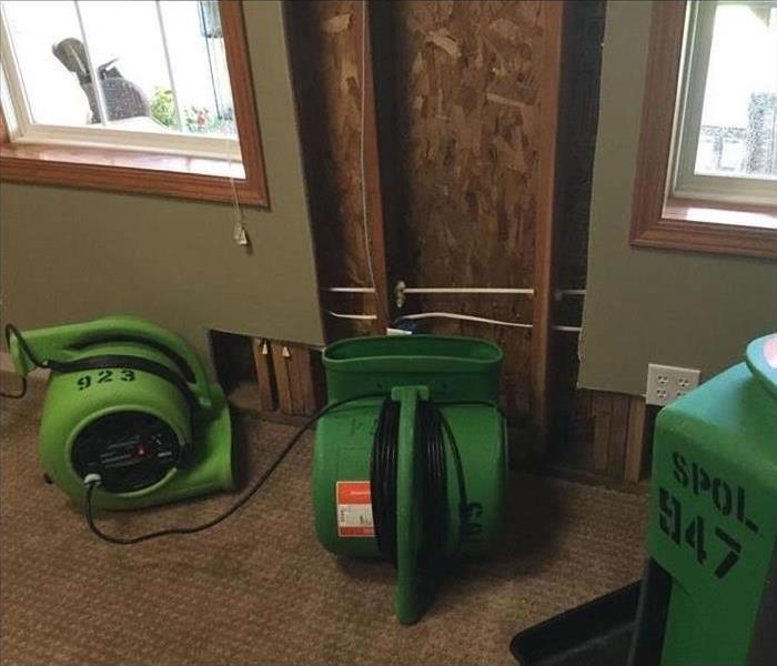 Three of our green machines drying the water damage in this property